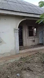 Setback 2 bedroom bungalow on a full plot facing the road Lagos