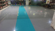 Industrial Epoxy Flooring Services with Yellow Safety Marking from Pune