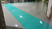 Industrial Epoxy Flooring Services with Yellow Safety Marking from Pune
