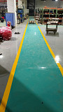 Industrial Epoxy Flooring Services with Yellow Safety Marking from Pune