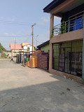 15shops plaza with 4 empty plots of land directly behind. Lagos