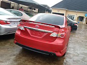 Smooth Red 2013 Toyota Corolla for sale from Ikeja