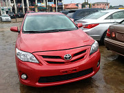 Smooth Red 2013 Toyota Corolla for sale from Ikeja