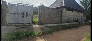 Distress Land for sale with uncompleted 3 bedroom bungalow en-suite (not roofed) andRoofed mini shop Ebute Ikorodu